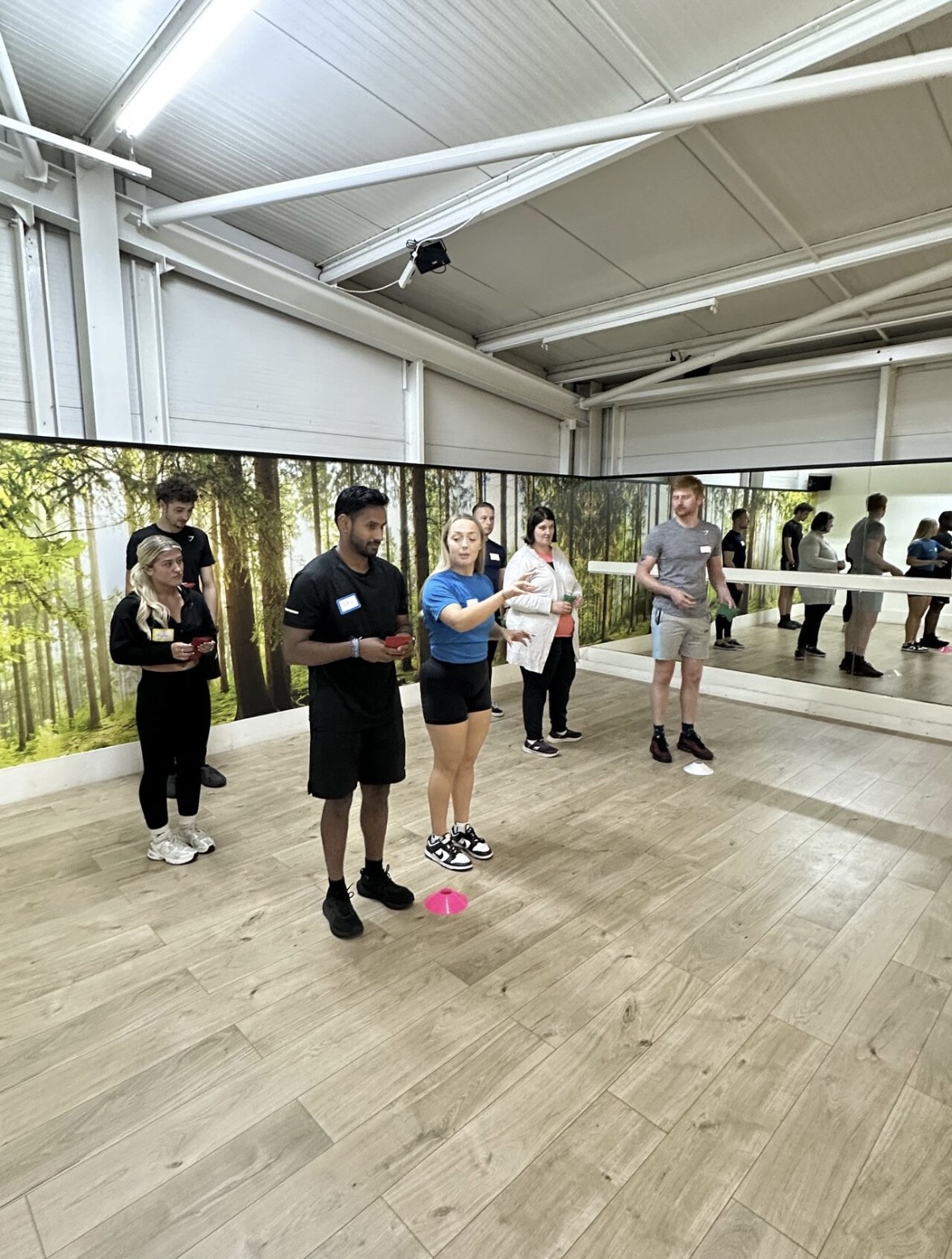 Two guys complete fitness drill using Blazepod
